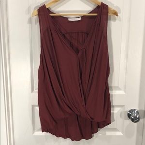 Lush flowy, rust coloured sleeveless blouse.